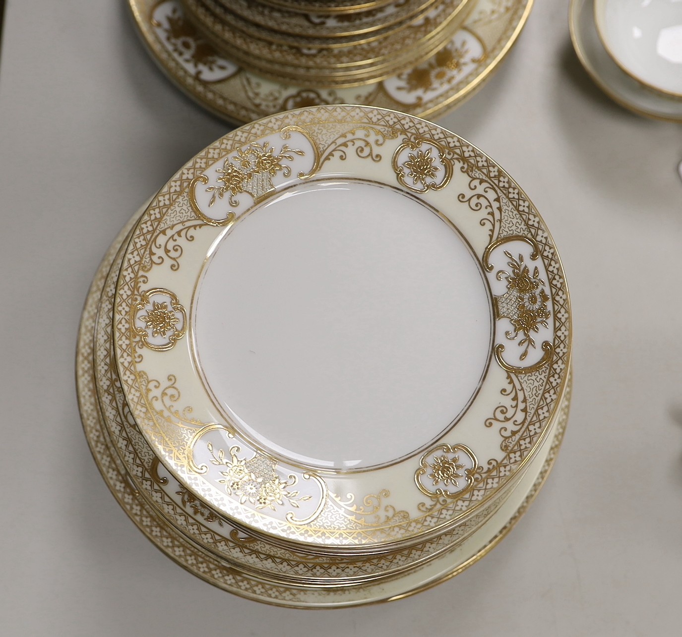 A Noritake gilt bordered dinner service